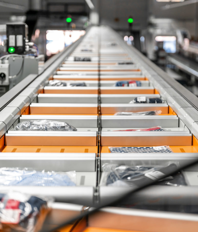 Apparel and accessories sorting equipment at work.